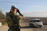 UN Peacekeeper looks out over Israel-Lebanon border