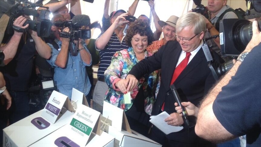 Prime Minister Kevin Rudd casts his vote at in East Brisbane on election day