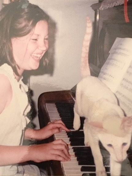 Georgie practicing piano-shortly before meeting John Aitchison.jpg
