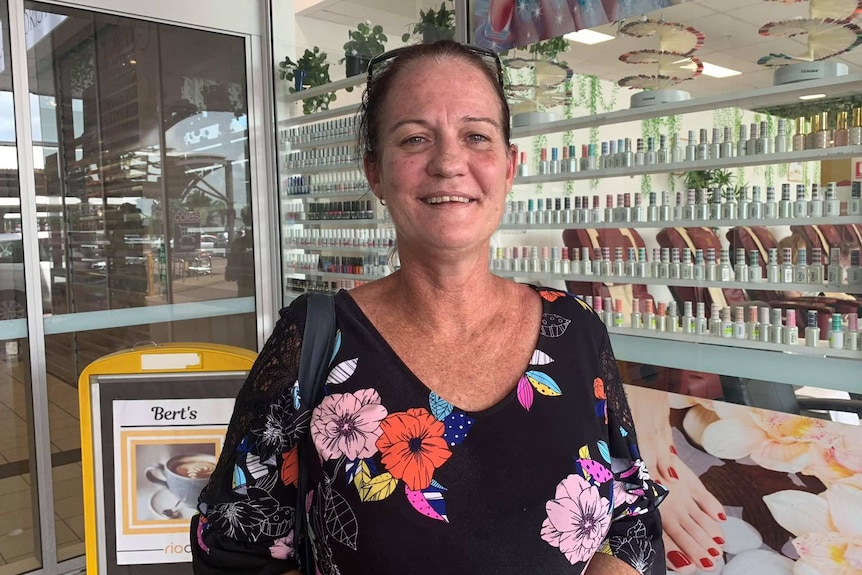 Darwin resident Jodie Went stands and smiles for the camera.