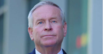 Former WA premier Colin Barnett in a blue suit and shirt with blue and red tie.