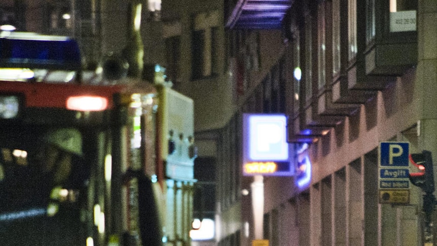 A firetruck is seen near a blast site caused by a car explosion in Stockholm