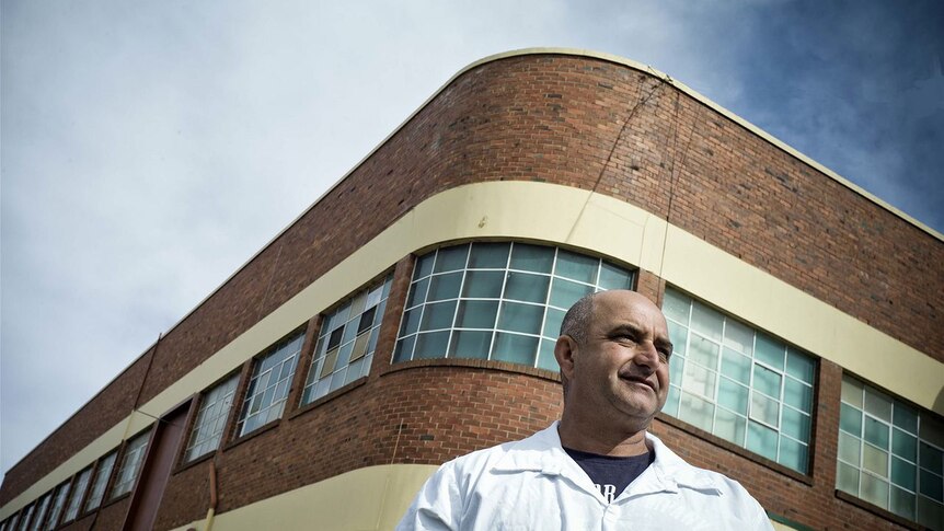 Phil Giancano outside the factory where he worked for a quarter of a century.