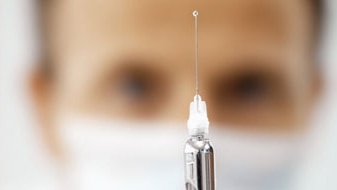 File photo: Front view portrait of medical practitioner holding syringe (Getty Creative Images: Stockbyte)