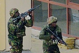 Kenyan soldiers move in formation outside the Westgate Mall in Nairobi.