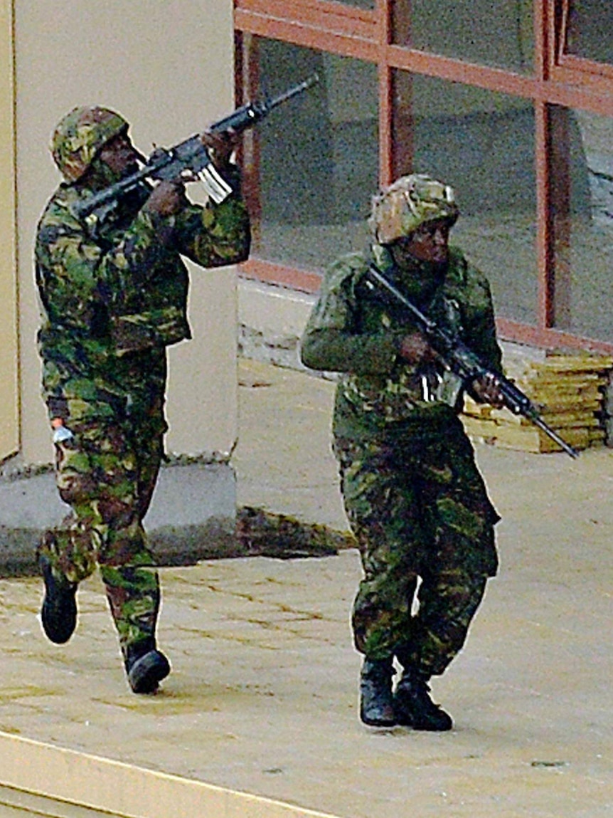 Kenyan soldiers move in formation outside the Westgate Mall in Nairobi.