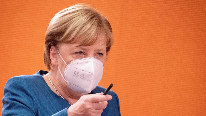 German Chancellor Angela Merkel wears a mask.
