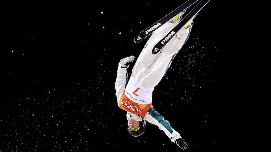 Laura Peel upside down in the air as she competes in the women's aerials final at the Olympic Winter Games.