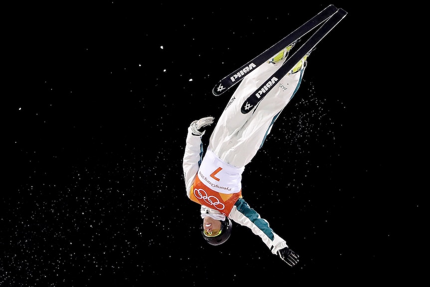 Laura Peel upside down in the air as she competes in the women's aerials final at the Olympic Winter Games.