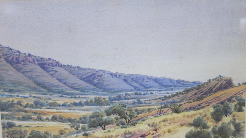 One of the original Albert Namatjira watercolours hang in dining room of an outback roadhouse.