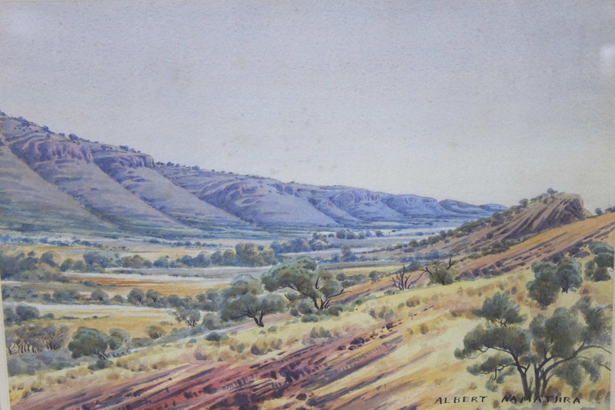 One of the original Albert Namatjira watercolours hang in dining room of an outback roadhouse.