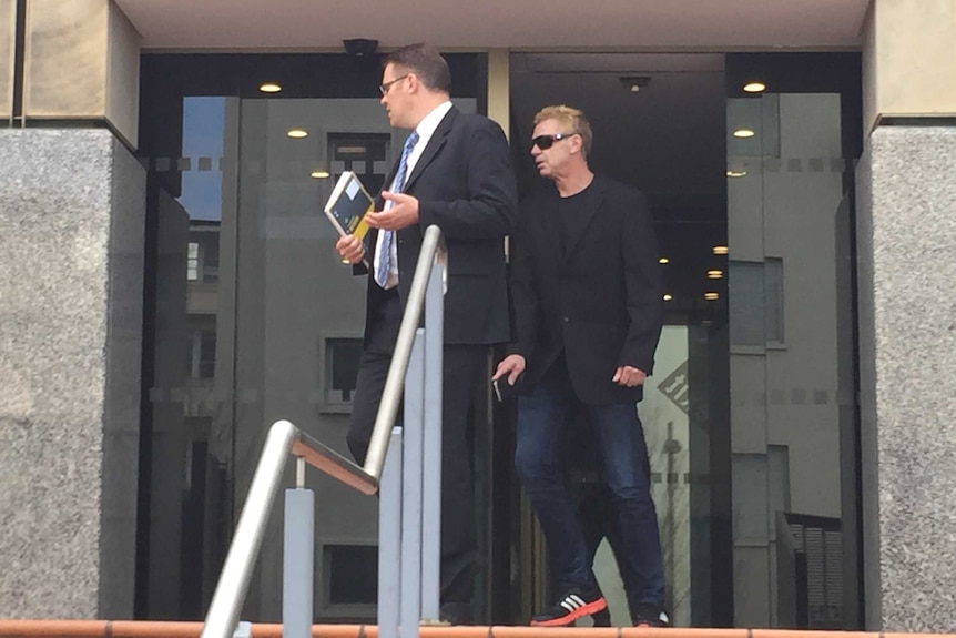 Shane Farmer leaves court.