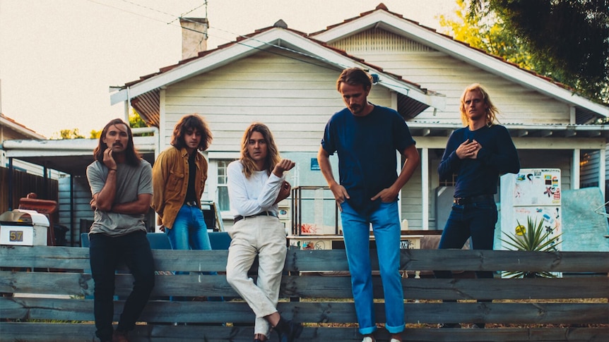 A 2017 press shot of Brisbane band The Belligerents outside a suburban house