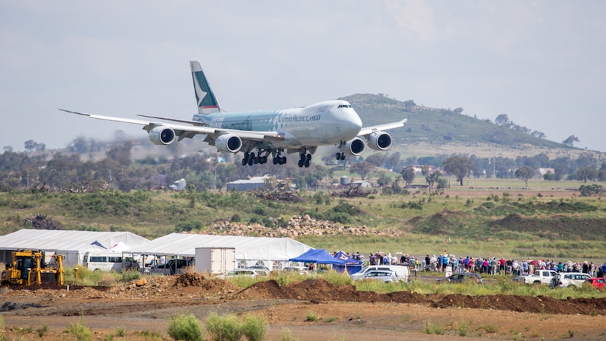 The 747 lands at Wellcamp in front of a large crowd