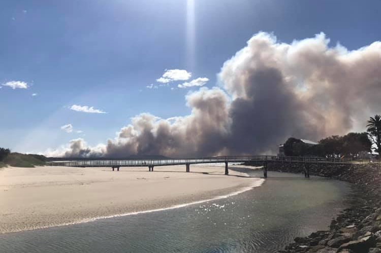 smoke from a bushfire seen from a bridge