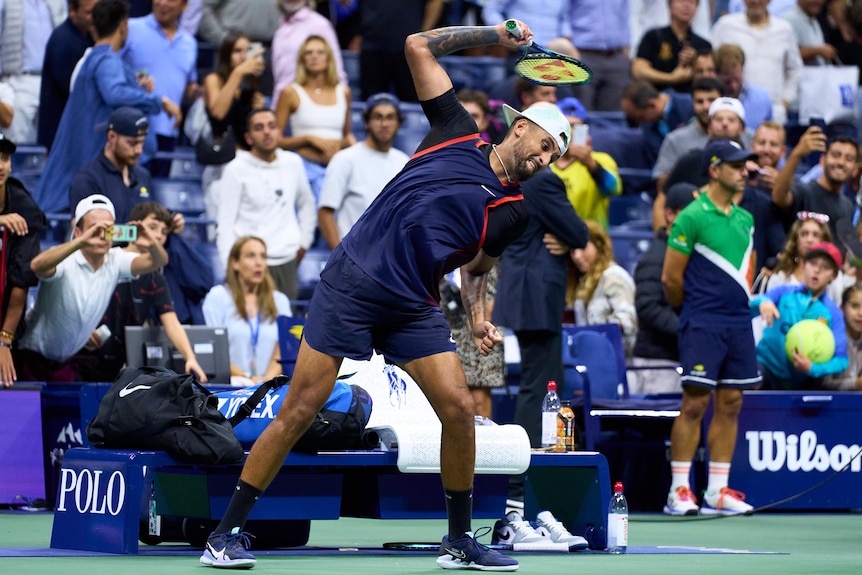 Nick Kyrgios throws a tennis racquet after losing a US Open quarter-final to Karen Khachanov.