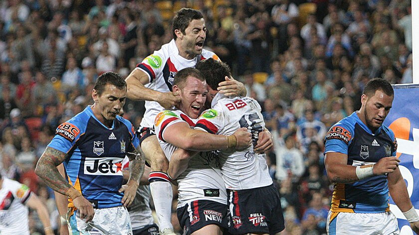 Riding high ... Anthony Minichiello and the Roosters celebrate Daniel Conn's second-half try.