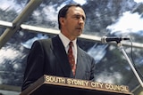 Paul Keating speaks into a microphone at a lectern labelled with South Sydney City Council.