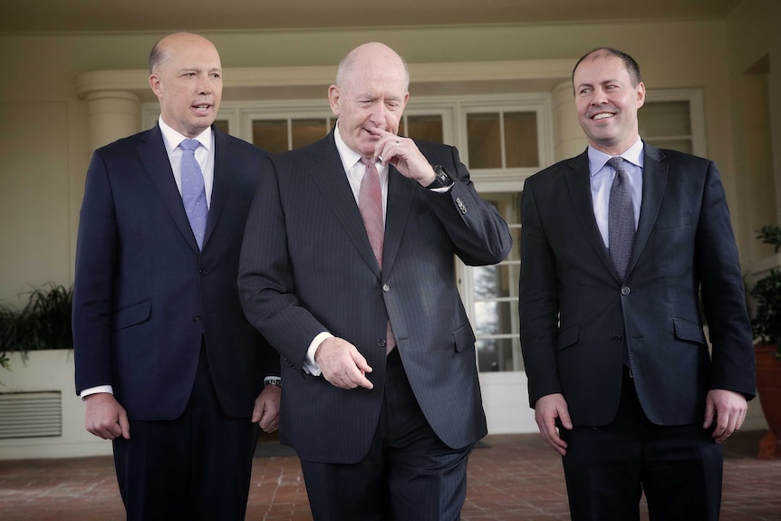 Peter Dutton, Governor-General Peter Cosgrove and Josh Frydenberg smile in front of a house