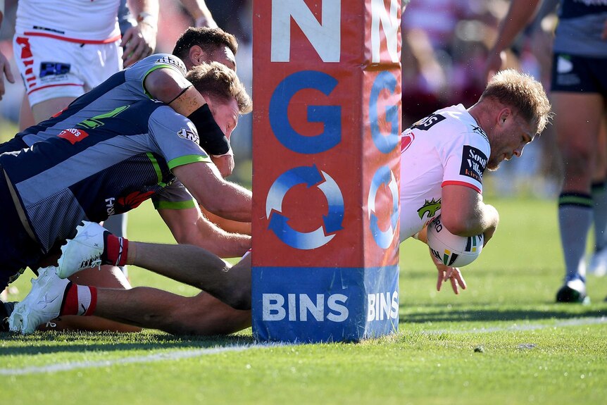 Jack De Belin of the Dragons scores a try against the Raiders in Mudgee.