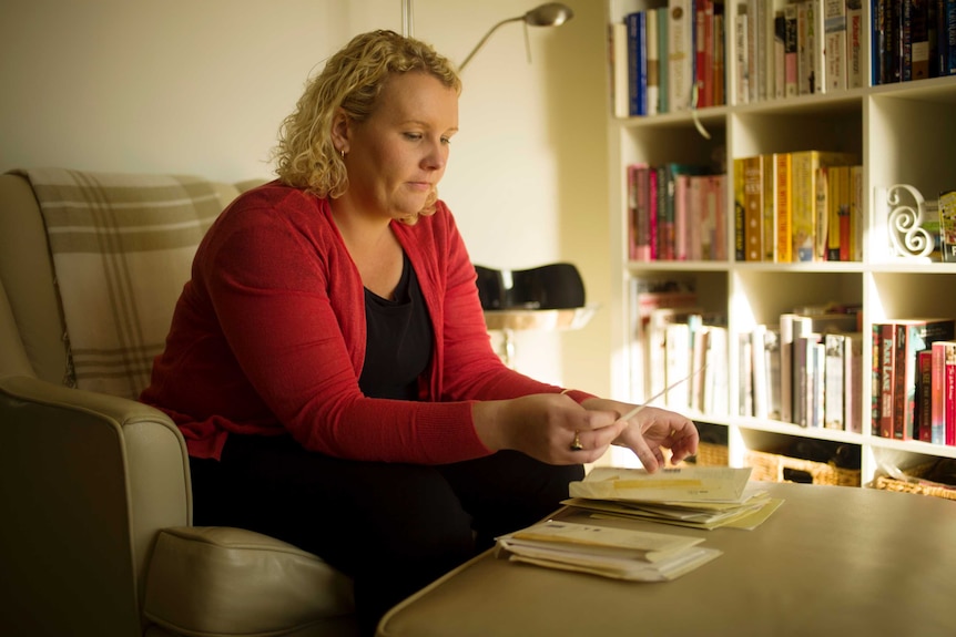 Elisha Rose sifts through letters penned by her father