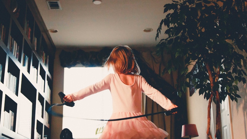 Girl skipping in loungeroom