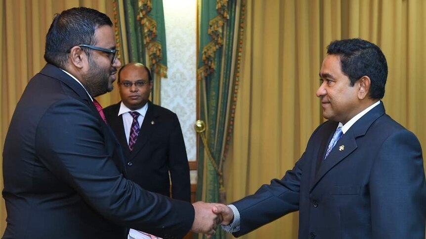 Ahmed Adeeb being sworn in by President Yameen