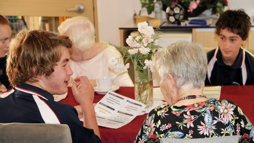 Year 11 students from Belridge Secondary Education Support Centre have a cup of tea with elderly residents.