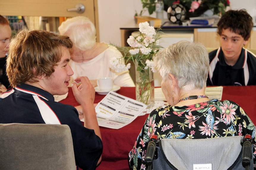Year 11 students from Belridge Secondary Education Support Centre have a cup of tea with elderly residents.