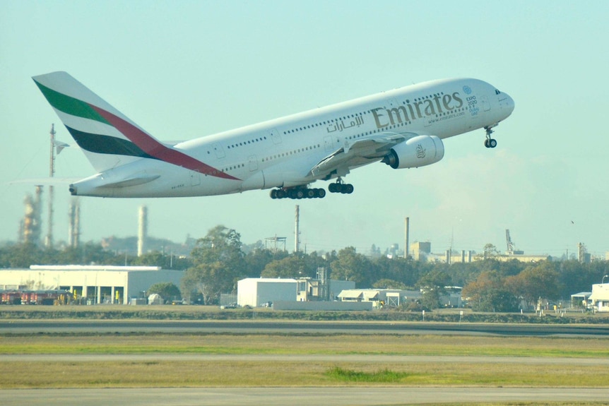 Large Emirates aircraft takes off.
