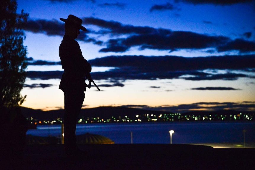 Silhouetted soldier at Hobart Dawn Service, Anzac Day 2018.