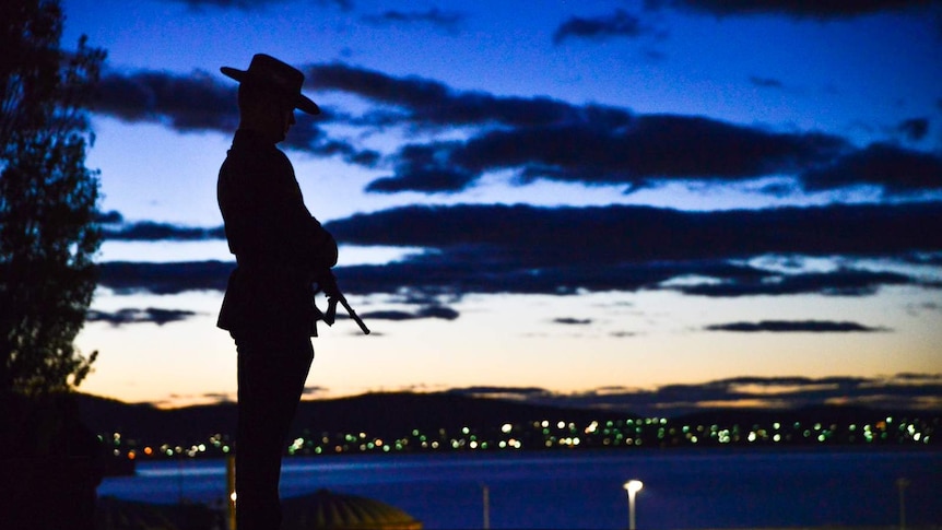 Silhouetted soldier at Hobart Dawn Service, Anzac Day 2018.