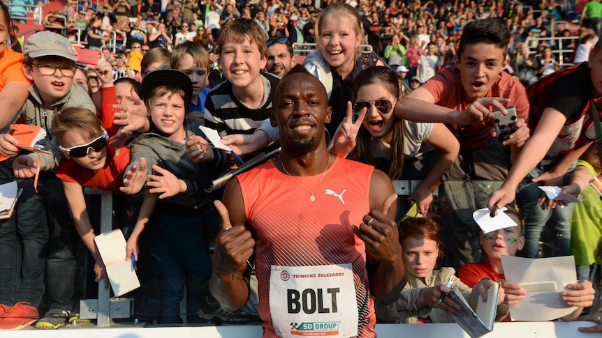 Jamaica's Usain Bolt poses with fans after winning the 100m at the Golden Spike meeting at Ostrava.