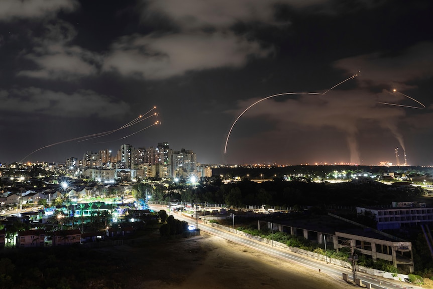 Israel's Iron Dome missile defense system fires interceptors at rockets launched from the Gaza Strip.