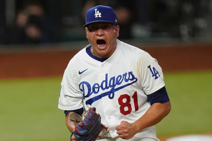 A LA Dodgers pitcher screams out as he celebrates striking out against Tampa Bay Rays.