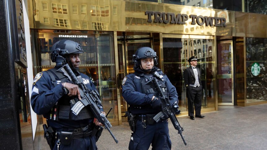 New York City Police officers guard the front of Trump Tower