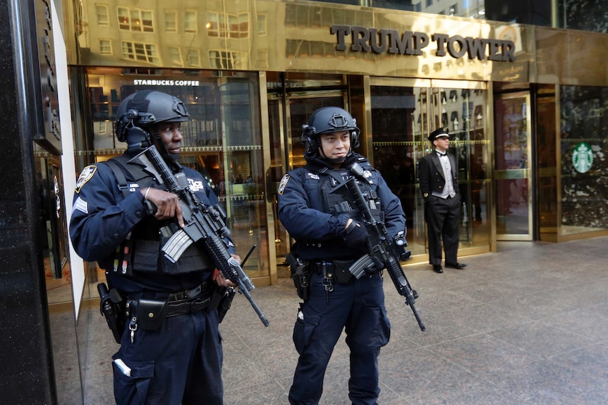New York City Police officers guard the front of Trump Tower