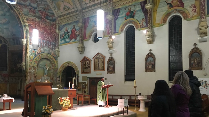 Interior of St Mary's Church in Bairnsdale, Father Avanish George delivering mass