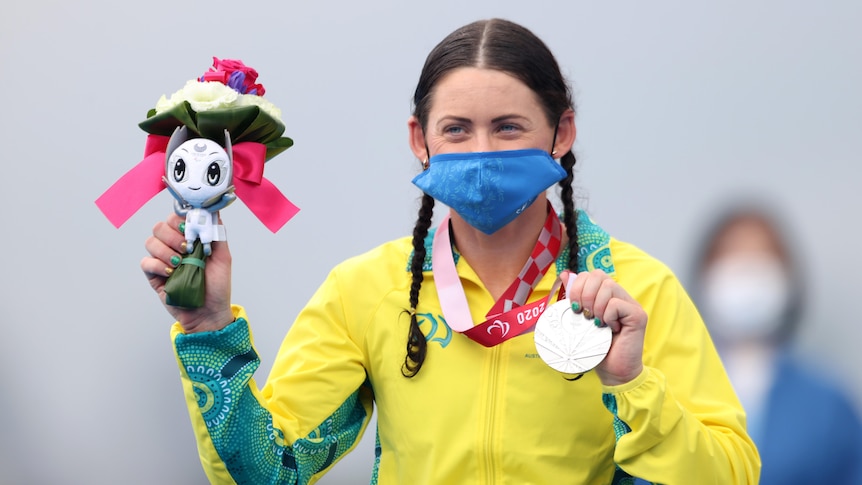 Lauren Parker holds her Paralympic silver medal.