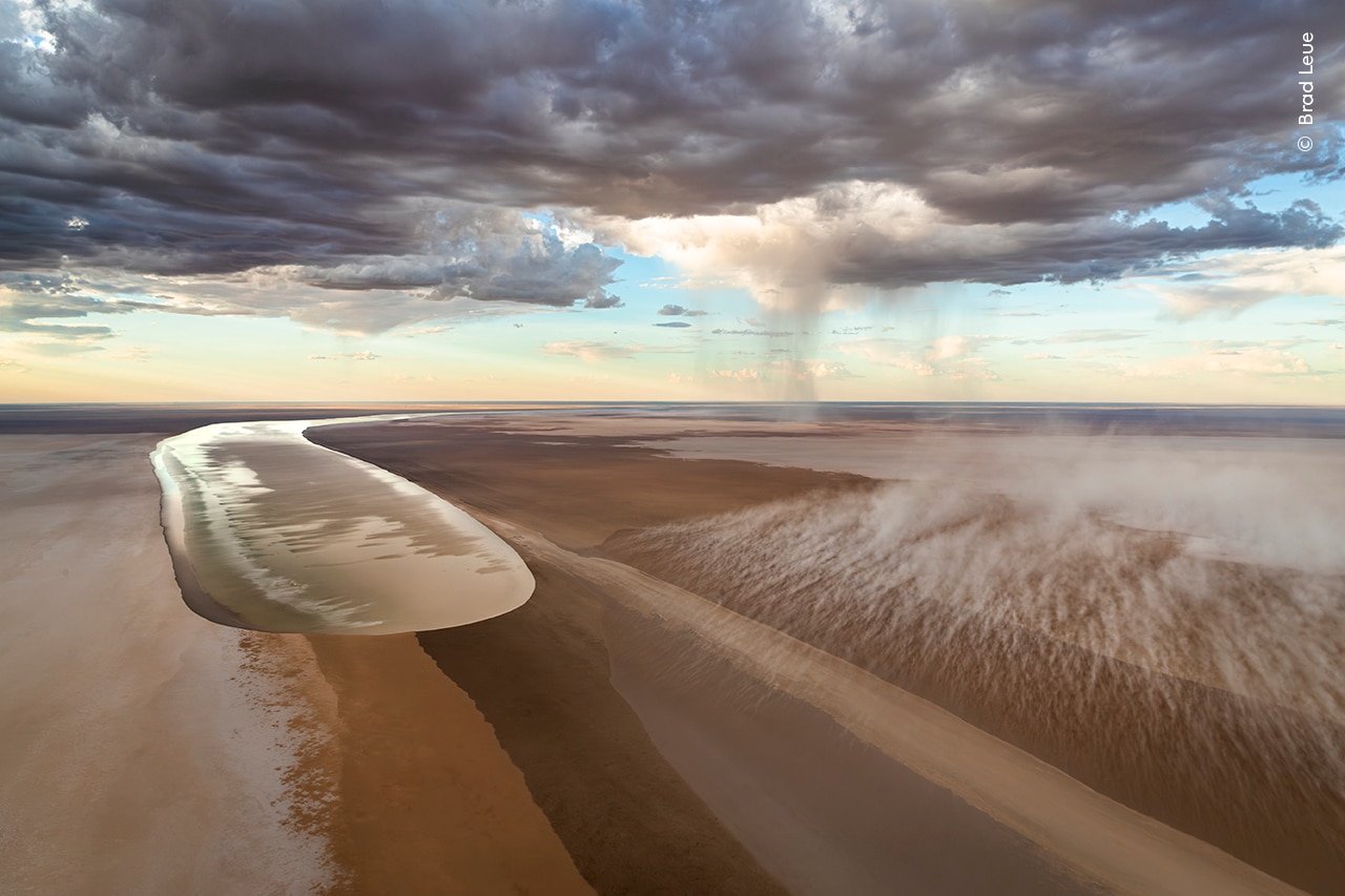 A huge amount of water travels through a dry riverbed