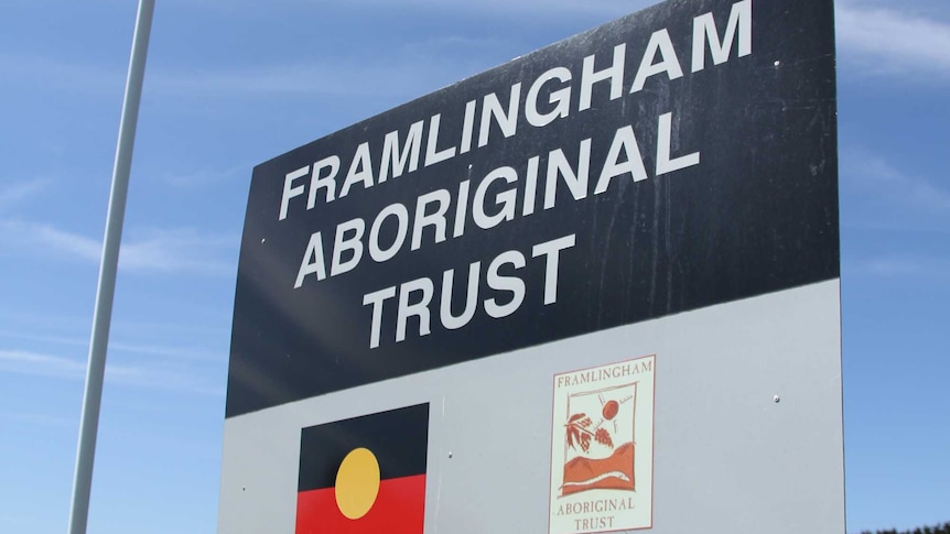 A sign reads Framlingham Aboriginal Trust while an indigenous flag flies in the background.