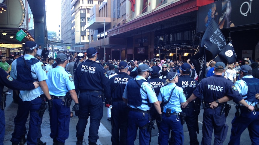 Police stand guard as Sydney's Muslim community protests