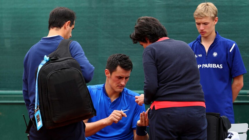 Bernard tomic receives medical treatment at French Open