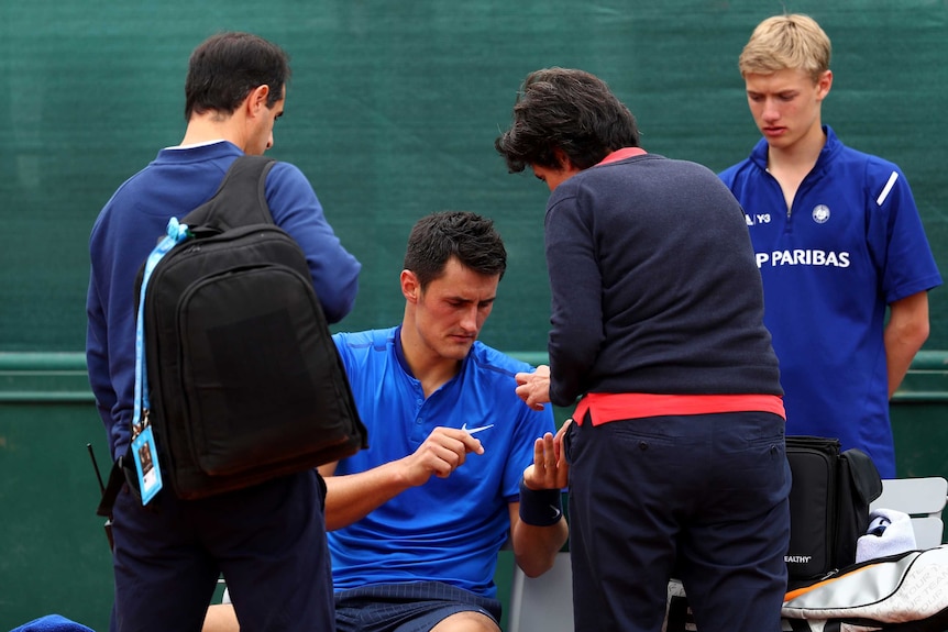 Bernard tomic receives medical treatment at French Open