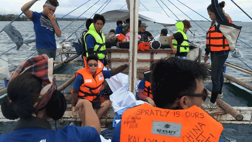 Activists from Kalayaan Atin Ito on a boat