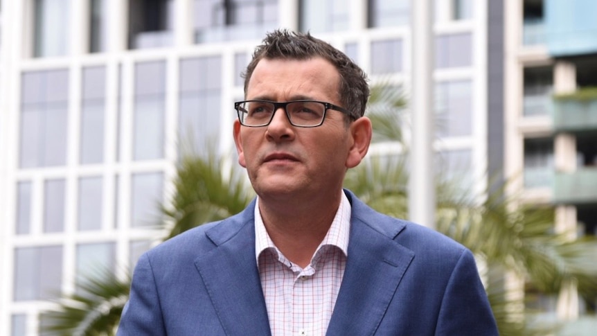 Daniel Andrews speaks to reporters.