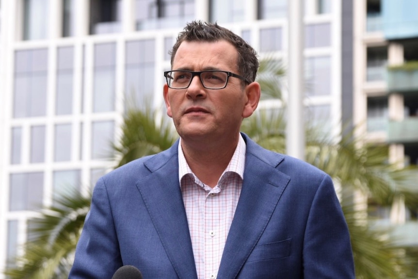 Daniel Andrews speaks to reporters.