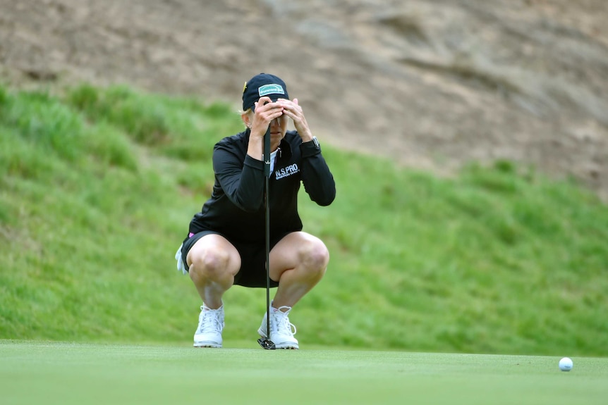 Karrie Webb sizes up a putt during her second round before missing the cut at Royal Adelaide.