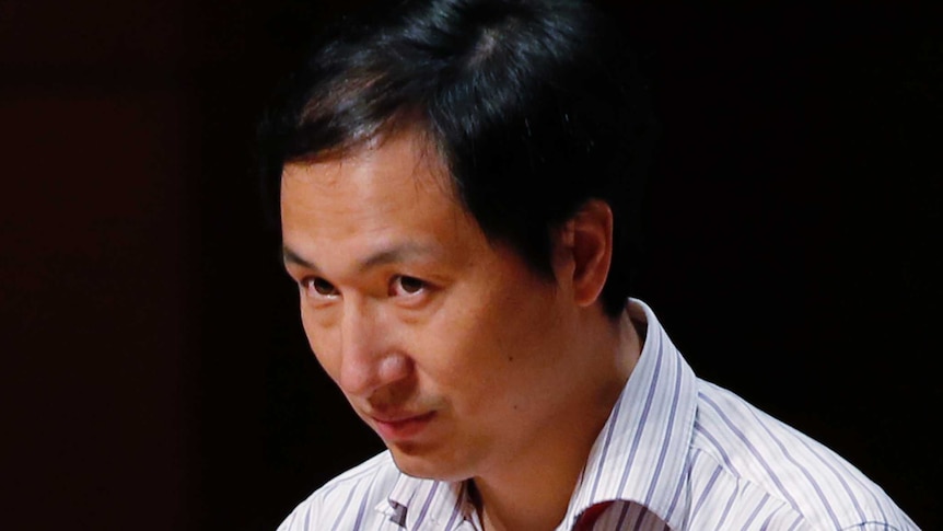 A head shot of Dr he speaking into a microphone.