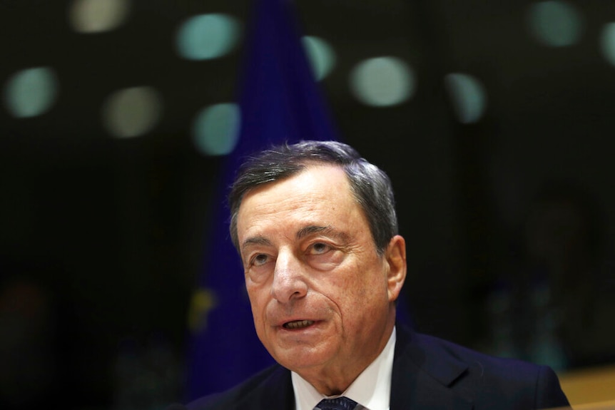 Mario Draghi wearing a suit, mid-speech.